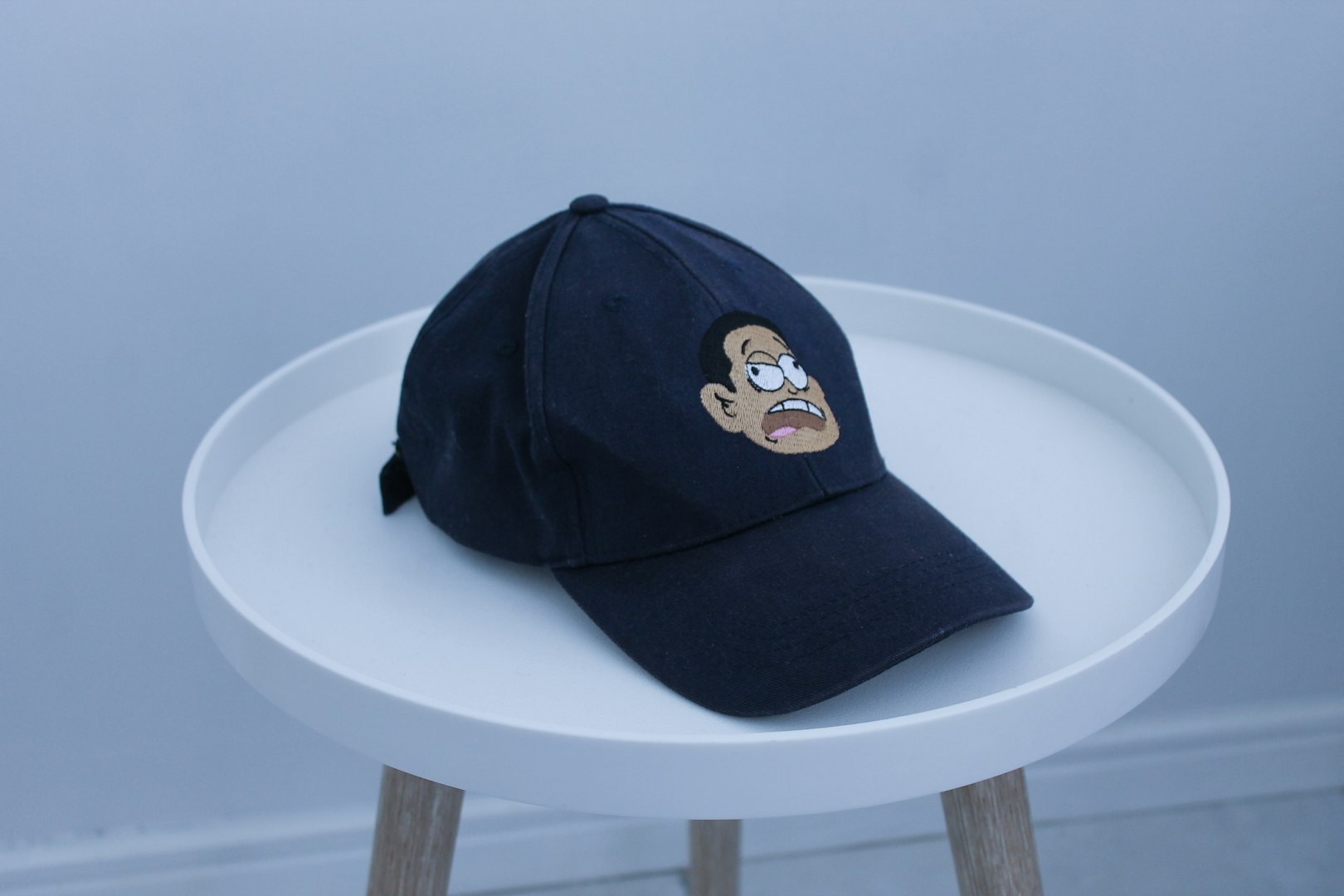 a black hat on a white table